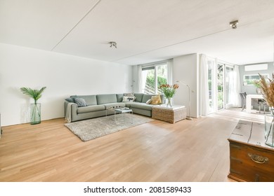 Large Soft Green Sofa In A Cozy Living Room