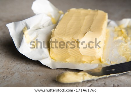 Large Softened Stick of Butter on Wrapping Ready to Eat