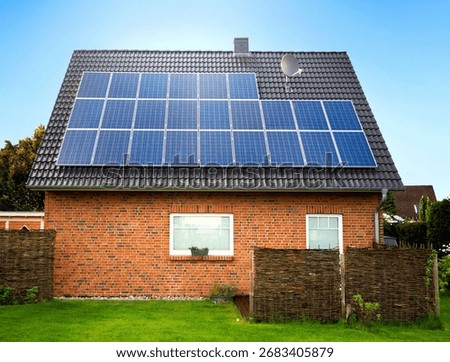 large solar panel on a rooftop, with dark cloudy background