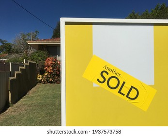 Large Sold Sign On Home Front Yard. Real Estate Housing  Property Market Concept. No People. Copy Space