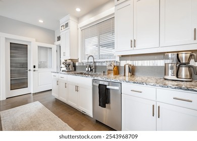 large and spacious open concept kitchen with large island stainless appliances bright sunny room interior workspace for family cooking and dining