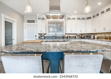 large and spacious open concept kitchen with large island stainless appliances bright sunny room interior workspace for family cooking and dining - Powered by Shutterstock - Get 15% off with code: PIKWIZARD15