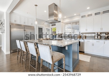 large and spacious open concept kitchen with large island stainless appliances bright sunny room interior workspace for family cooking and dining