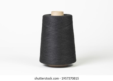 Large spool of thread, black, close-up. Isolated on white background - Powered by Shutterstock