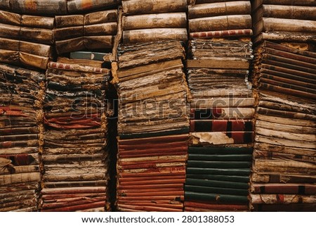 Large Stack Of Antique Leather Bound Books With Weathered Spines In A Historic Archive Or Library