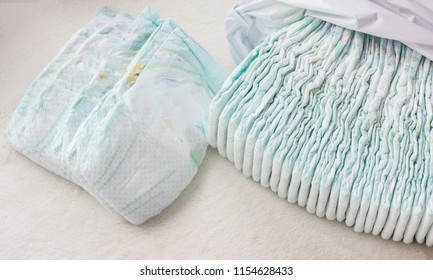 A Large Stack Of Baby Diapers, Close-ups, Diaper Packaging