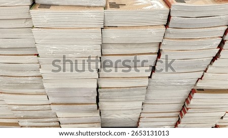 Large Stack of Books – Pile of Assorted Books Arranged in Vertical Tower for Education, Reading, Library, Literature, Knowledge, or Academic Concept Background. 