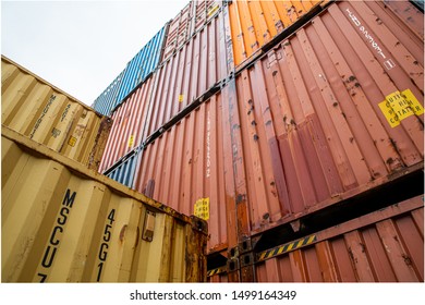 A large stack of shipping containers