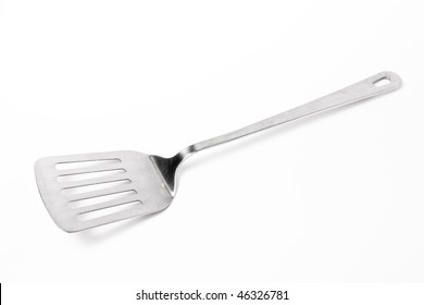 Large Stainless steel Kitchen spatula isolated against white background.