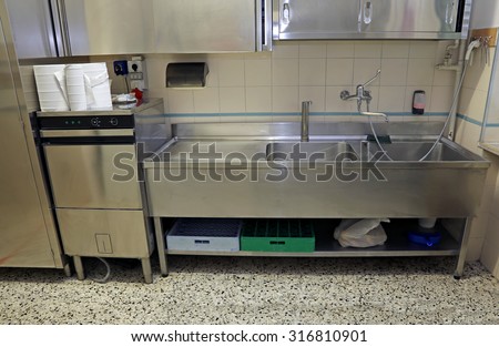 large stainless steel sink of industrial kitchen for preparing food
