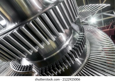 Large Steam Turbine With Shiny Blades And Holes At Plant