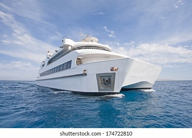 Large Steel Luxury Private Catamaran Motor Yacht Sailing Out At Sea