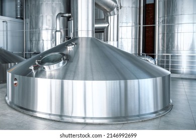 Large steel tanks for fermentation of beer drinks Industrial production of beer and alcohol - Powered by Shutterstock