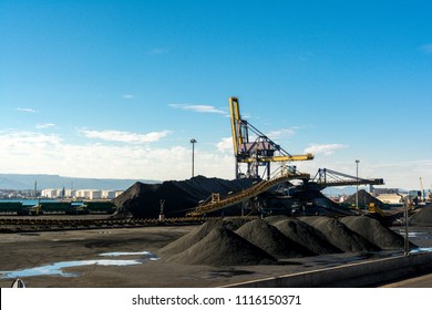 Large Stockpile Of Coal In Tarragona Port Terminal, Ready For Railroad Transportation To A Thermal Power Plant