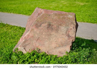 A large stone by the road with a place for the text, copy space for the inscription