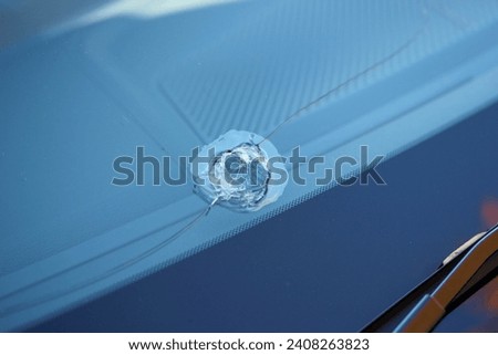 Large stone chip in a car windshield