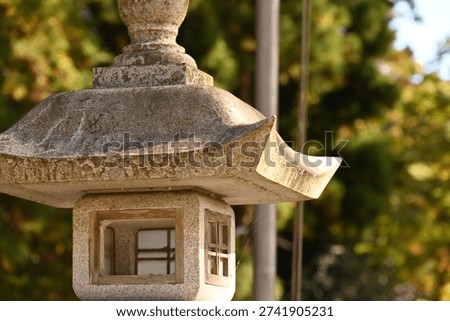 A large stone lantern with a solid, imposing presence