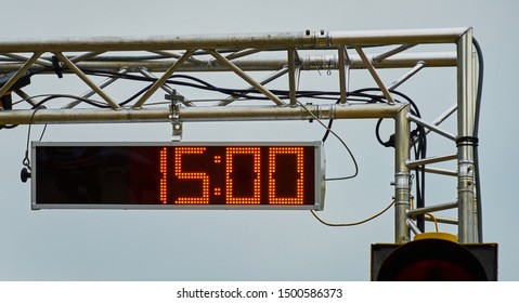 Large Stopwatch With Digital Display Showing The Time In 15 Seconds Suspended From A Galvanized Steel Tube Frame.