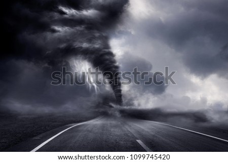 A large storm producing a Tornado, causing destruction. 