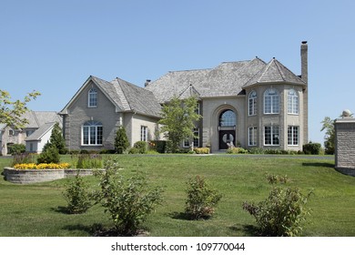 Large Suburban White Brick Home With Circular Living Room