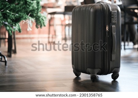 Large suitcases stand in the lobby of the hotel on the background