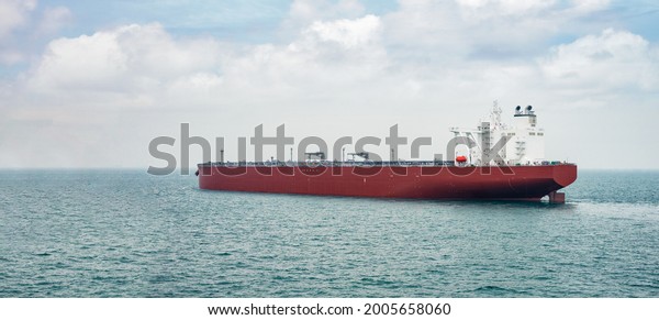 Large super\
tanker loaded with crude oil at\
sea.