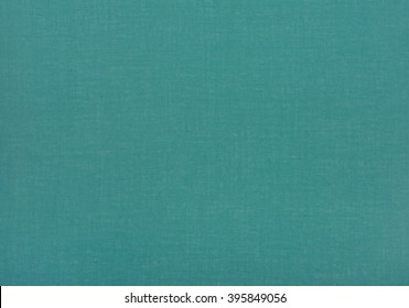Стоковая фотография: Large Swatch of Plain Dark Cyan Teal Green Burlap laying flat and smooth on a wall or table as a background with texture and extra blank room or space for copy, text, your words or design. Horizontal