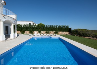 Large Swimming Pool In The Garden Of A Luxury Villa On The Algarve
