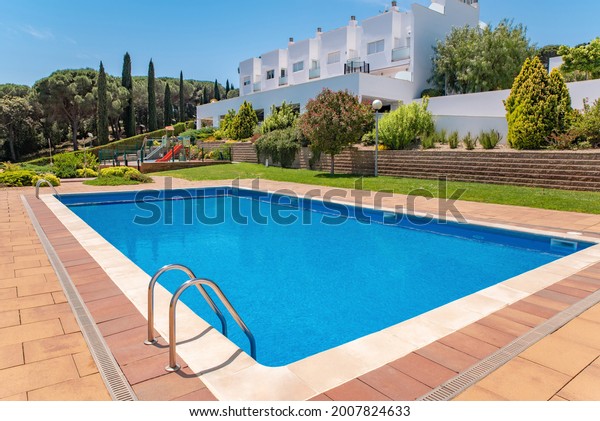 Large\
swimming pool in a public area in a gated\
community
