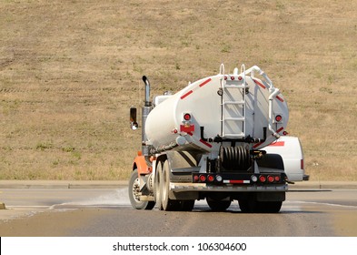 Large tank truck working at a construction site