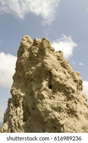 Large Termite Mound Againt Blue Skies In Tanzania, Africa.