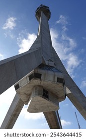 A large tower with a view at the top .