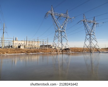 Large Transmission Towers With Power Lines And A Natural Gas Plant Producing Clean Energy In Calgary Alberta Canada.