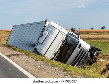 The Large Truck Lies In A Side Ditch After The Road Accident.