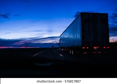 Large truck for shipping goods on a highway after sunset
