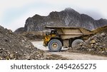 Large truck transports gold ore, Haul truck carries waste rock in the open pit copper mine