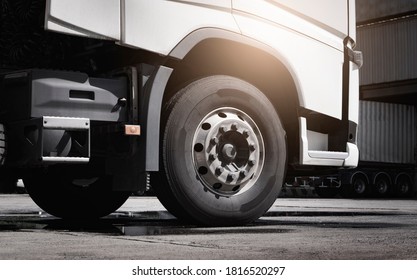 Large A Truck Wheels Of Semi Truck. Road Freight Cargo By Truck Transportation.