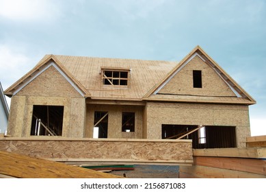 Large Two Story Family Home Under Construction Plywood Roof Window