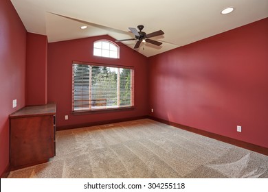 Large Unfurnished Room With Red Interior Paint.