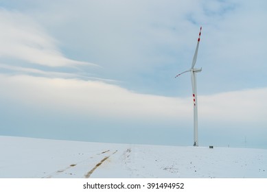 Large view on the windmill on the field in winter season