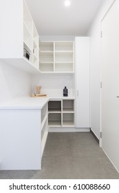 Large walk in butlers pantry storage area in a new home