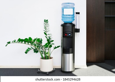 Large Water Dispenser In The Office, With Cold And Hot Taps.