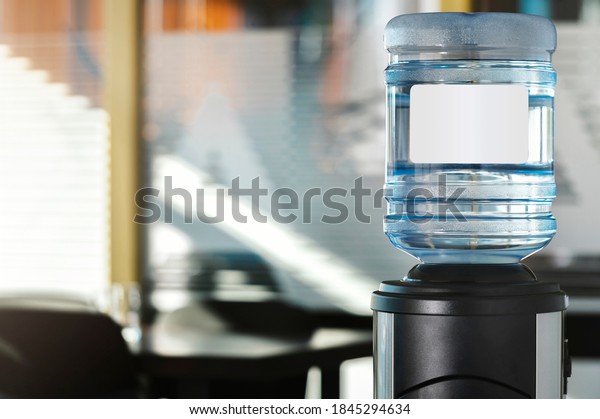 Large water dispenser in the office, with cold and\
hot taps.