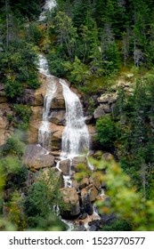A large waterfall cascading down the mountain side.