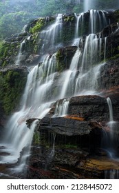 Large Waterfall Cascading Down Rocks In Blue Mountains Australia