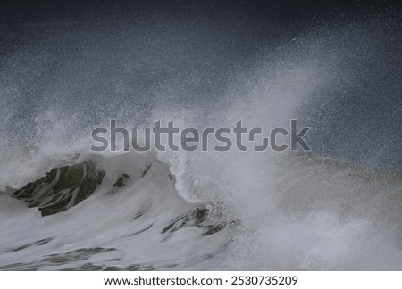 Large waves with spume created by strong winter winds