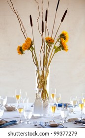 A Large Wedding Table Centerpiece With A Sunflower Bouquet