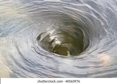 large whirlpool in the center of a river