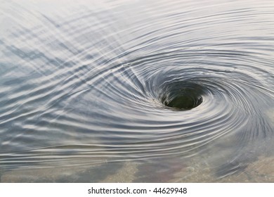 large whirlpool in the middle of a river