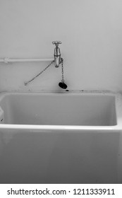 A Large White Belfast Sink In A Utility Room